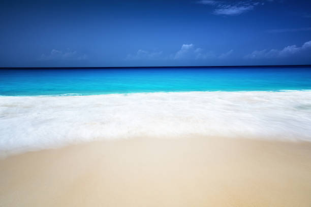 istock seychelles beach in sunny day, long exposure blur 528298090