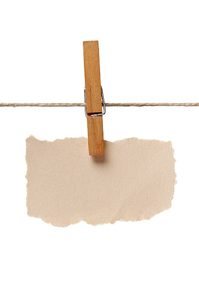 istock clothes peg and note paper on clothes line rope 528299800