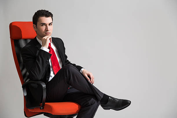 istock Man sitting with crossed legs 528299862