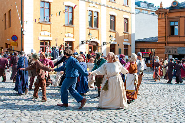 Turku, Finland - June 30, 2013: The Medieval Market of Turku is historical reenactment event and includes a handicrafts market with participants garbed in period costumes in Turku, Finland.