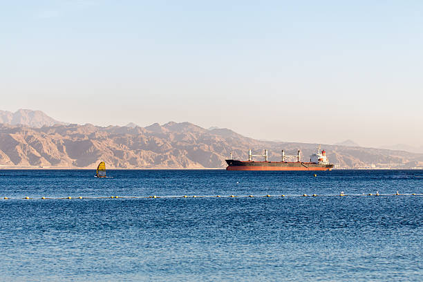 istock Cargo ship wind surfing vessel Red sea Israel. 528300378