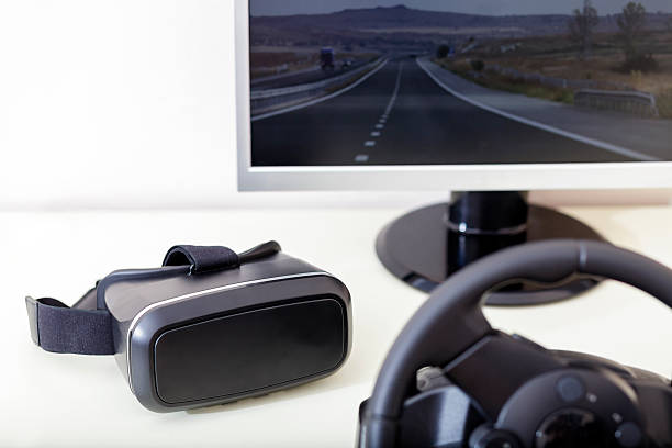 istock Virtual Reality Glasses VR Headset and Racing Wheel Equipment 528300574