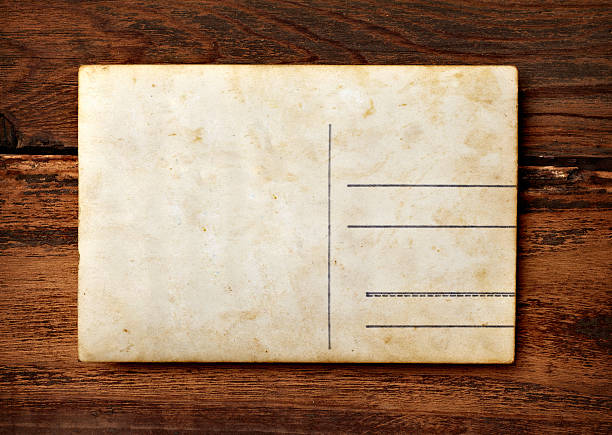 istock old photo postcard and clothes peg on wood 528303024