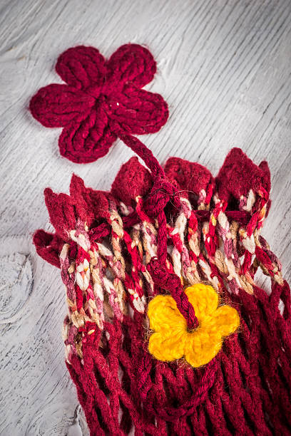 istock Rustic knitted leg warmers and knitted flowers 528303452