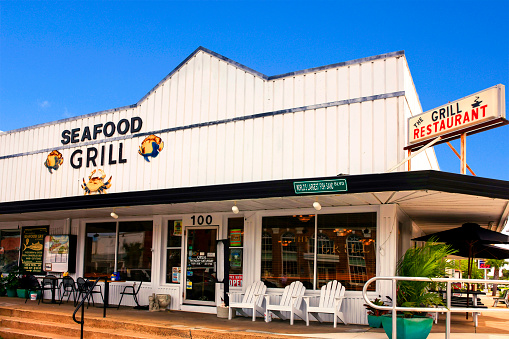 Apalachicola, FL, USA - April 11, 2016: The Seafood Grill restaurant on the square in Apalachicola, Florida