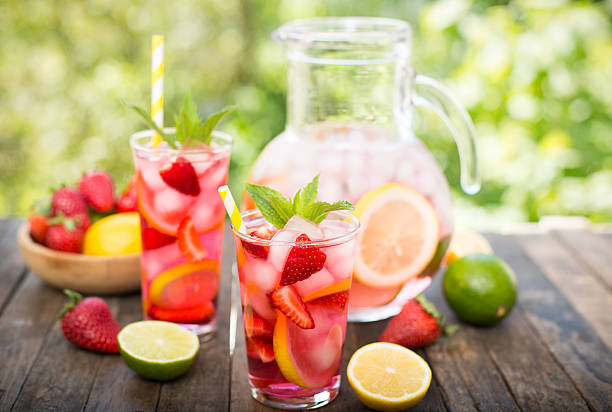 istock Pink lemonade with lemon, lime and strawberries 528303910