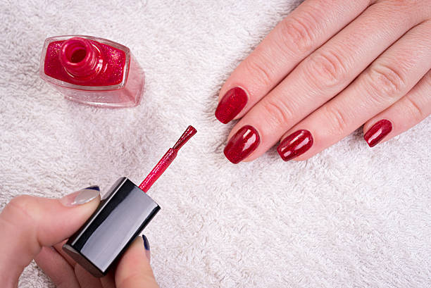 istock woman with manicure 528304374