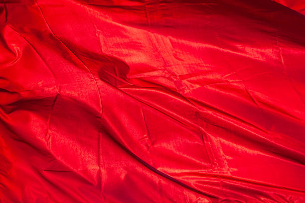 istock victory banner red fabric on sunhine. background. 528306094