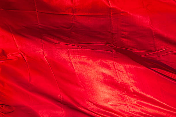 istock victory banner red fabric on sunhine. background. 528306138