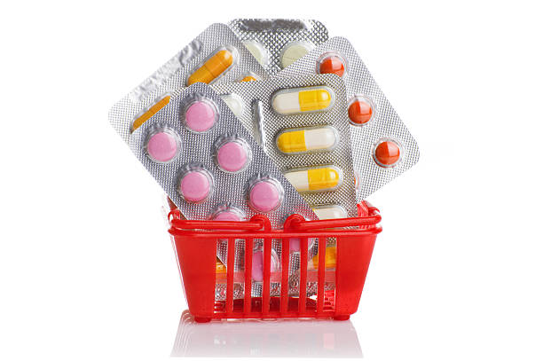 istock Shopping trolley with pills and medicine isolated on white 528306526