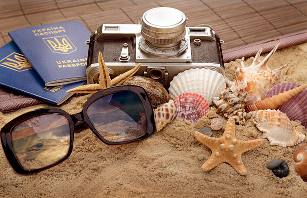 istock Tourist stuff. Vintage photo with sunglasses, seashells, passport documents and 528307016