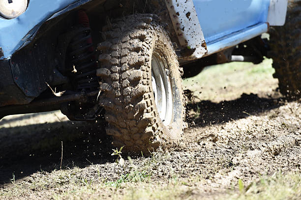 istock 4x4 vehicle with tires full of mud 528308314
