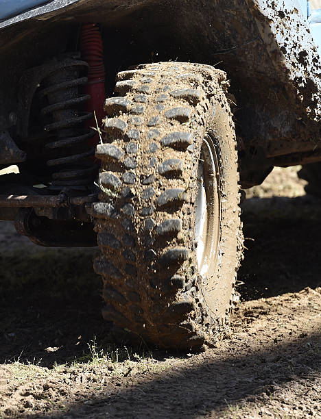 istock 4x4 vehicle with tires full of mud 528308350