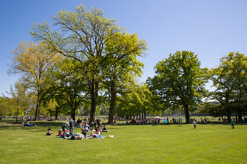 Geneva, Switzerland - May 5, 2016: People filling public parks on the Ascension day, a public holiday.