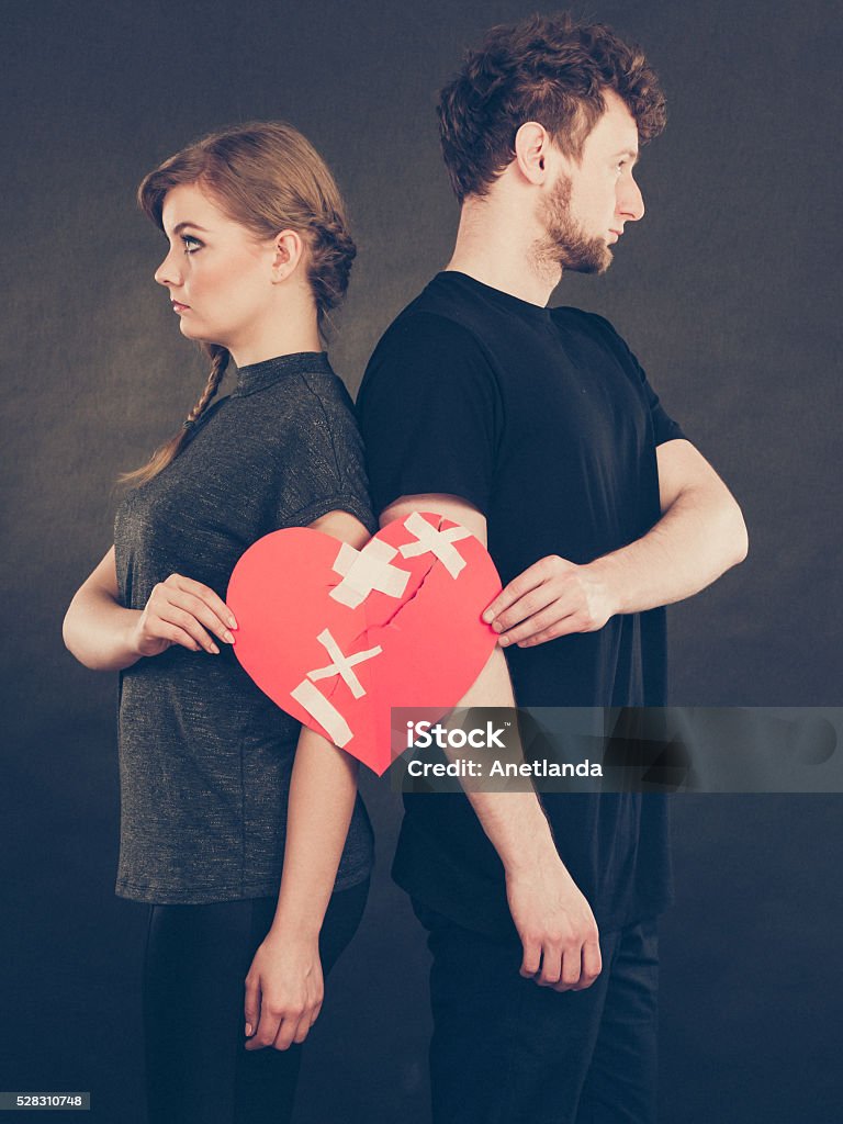 Sad Couple Holds Broken Heart Stock Photo - Download Image Now ...