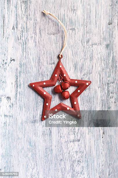 Vintage Christmas Star Decoration On Blue Painted Wood Stock Photo - Download Image Now