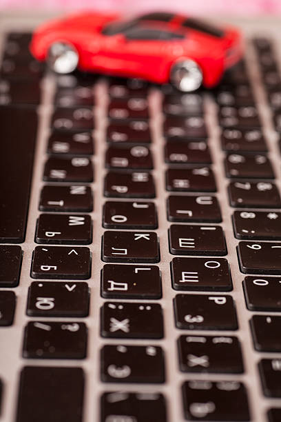 istock Toy car over laptop keyboard 528312083