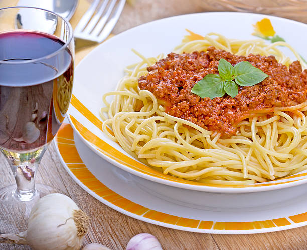 istock Spaghetti Bolognese and red wine 528313157