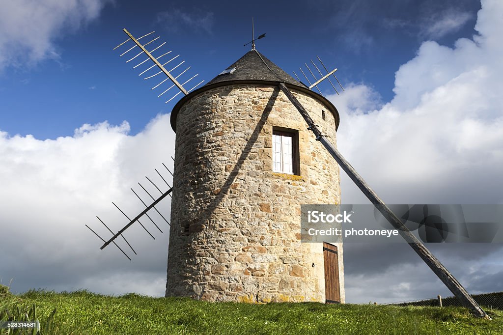 Windmill Windmill in sunlight, on the atlantic coast, france Abandoned Stock Photo