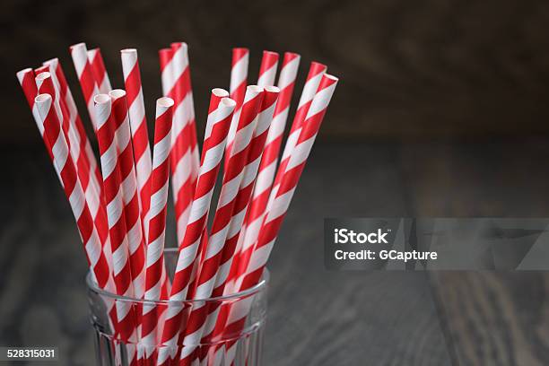 Vintage Paper Straws In Glass On Wood Table Stock Photo - Download Image Now - Drinking Straw, Straw, Paper Straw