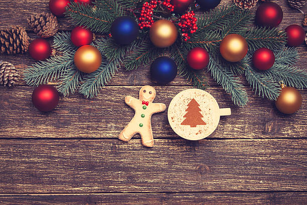 istock Hot cappuccino with christmas tree shape on a wooden table 528315135