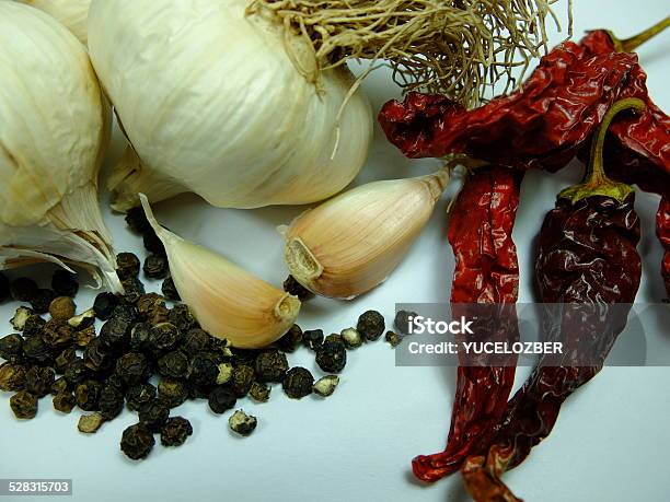 Whole Garlic With Black And Red Peper Stock Photo - Download Image Now - Black Peppercorn, Cayenne Powder, Chili Pepper