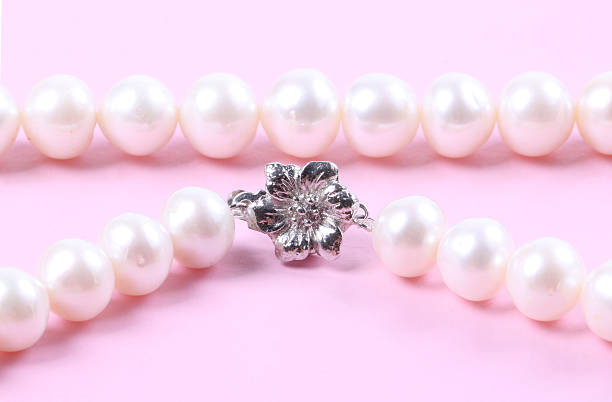 istock Beautiful creamy pearl necklace 528316275
