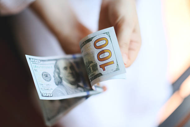 istock Dollars. Money in the hands 528316421