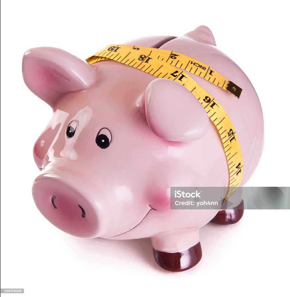 Piggy bank with tape measure. Piggy bank with tape measure isolated on a white background  Planning Stock Photo