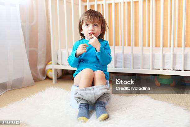 Lovely 2 Years Boy Sitting On Potty Stock Photo - Download Image Now - Potty, Child, Photography