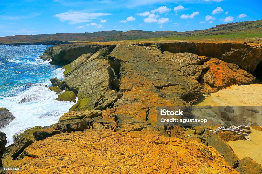 Natural bridge broken and deserted caribbean beach - Aruba You can see my collection of photos of stunning Island of Aruba and Mexico (Cancun & Riviera Maya) stunning Beaches and culture, sunrises, sunsets, and much others!!) in the following link below:  Aruba Stock Photo