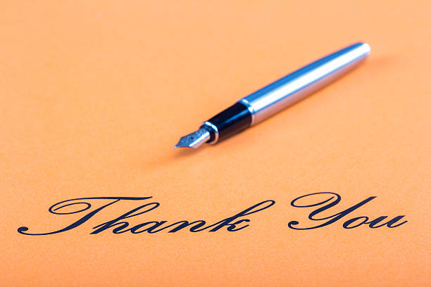 istock Hand writing fountain pen thank you 528337455