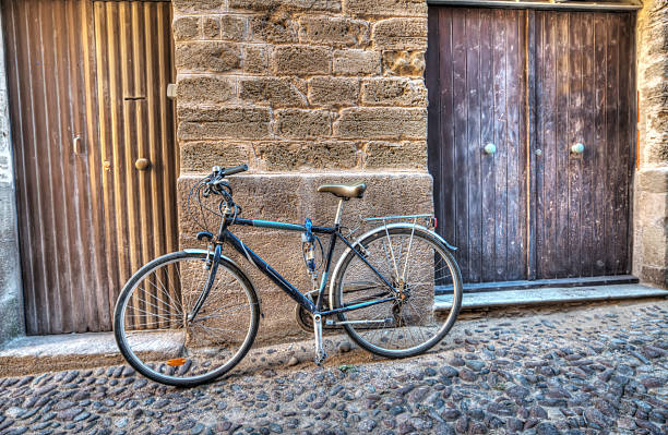 istock bicycle by the wall in Alghero old town 528339435