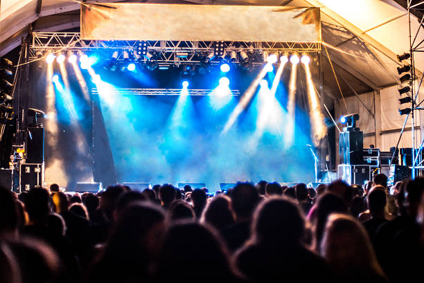 istock empty scenario music festival light blue ray people 528340125