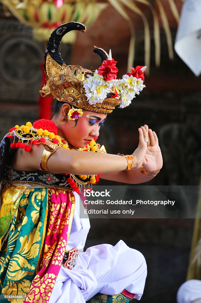 Indonesia: Barong Ceremony in Bali Denpasar, Indonesia - August 22, 2014: A Balinese dancer at a traditional Barong ceremony in Bali. The depiction of the battle between good and evil intertwines local history and mythology to create a parable for all ages. Bali Stock Photo