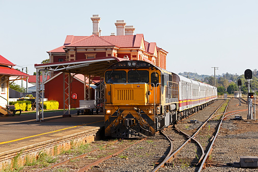 Toowoomba, Australia - November 15, 2014: Queensland Rail Travel’s diesel-hauled Westlander service between Brisbane and Charleville, waits at the impressive Toowoomba Station before resuming its 777km, 17hour journey to Brisbane.  When it leaves Toowoomba, the train will make the slow, winding descent down the Toowoomba Ranges.