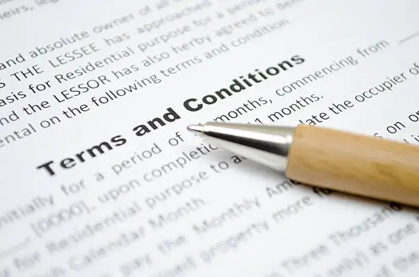 Terms and conditions with wooden pen