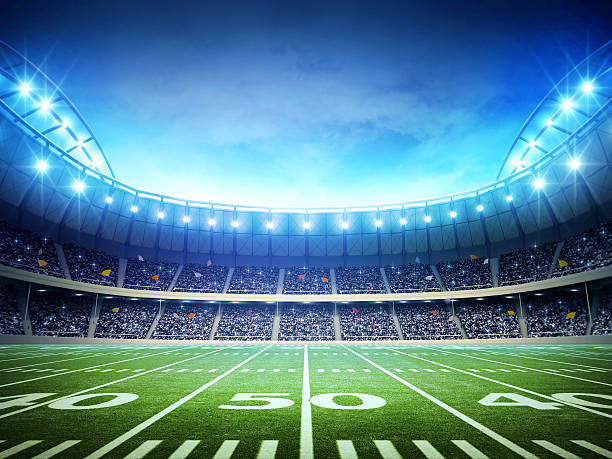 luci di stadio di calcio americano - pallone da football americano foto e immagini stock