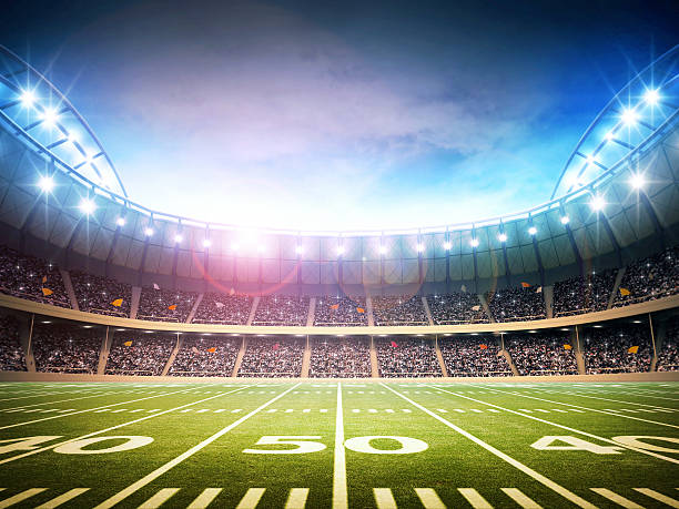 iluminação do estádio de futebol americano - bola de futebol imagens e fotografias de stock