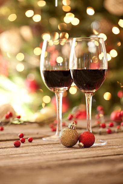 istock Christmas holiday red wine on old rustic wood dining table 528341465