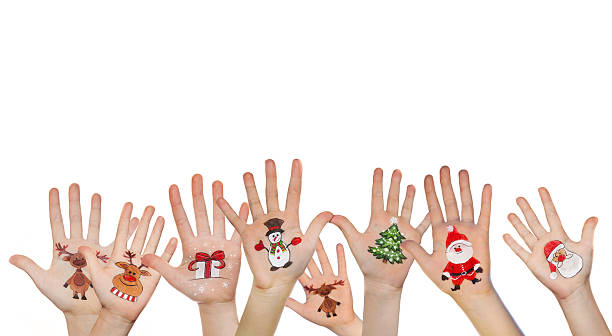 istock Kid's hands with painted Christmas symbol 528341499