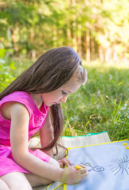 istock little girl drawing 528342677