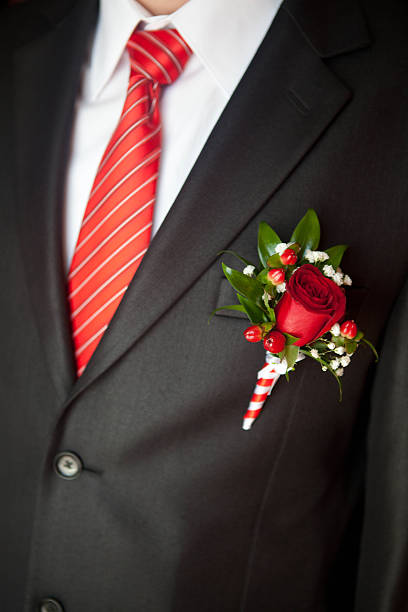 istock groom's suit close up with a striped tie and buttonhole 528343457