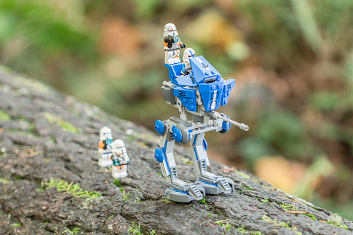 Eugene, Oregon, USA - November 8, 2014: A lego walker from Star Wars treking through the woods with Storm Troopers in tow.