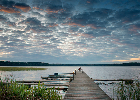 Fishing pier at dawn, lake Lilaste, Latvia