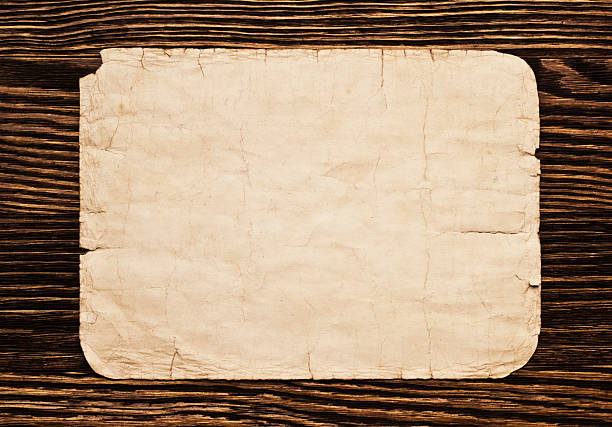 istock Old paper on the wood background 528359963