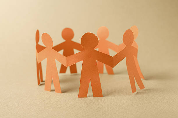 istock Group of paper chain people 528361271