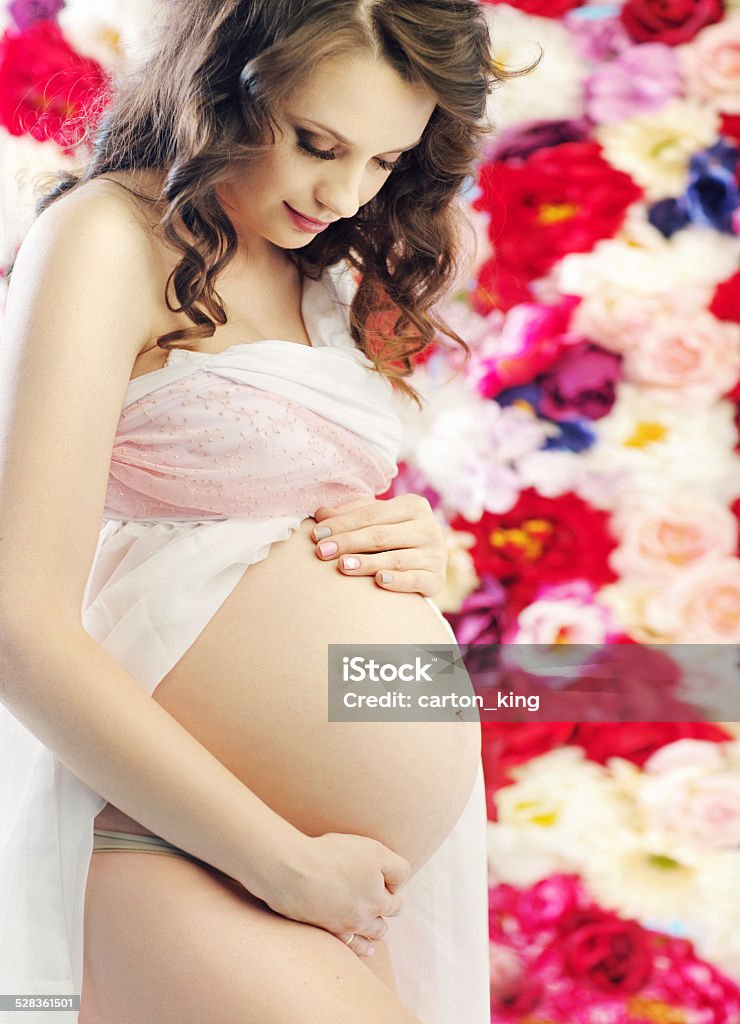 Portrait of a brunette pregnant woman Portrait of a brunette pregnant mother Abdomen Stock Photo