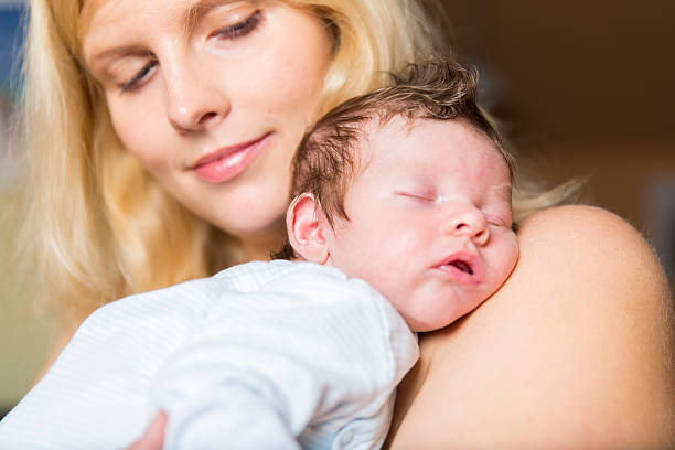 istock Young mother and newborn resting on her chest 528363013