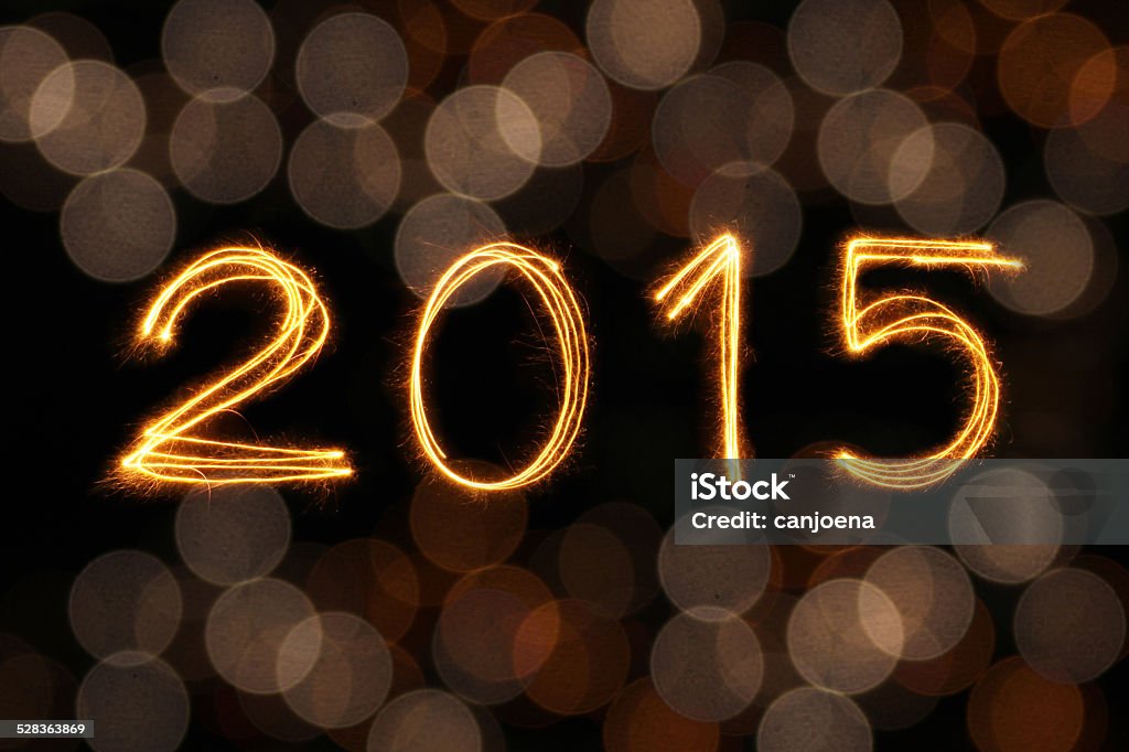 2015 written with Sparkling figures and colorful blur bokeh back 2015 written with Sparkling figures and colorful blur bokeh background 2015 Stock Photo